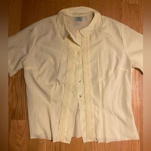 50s Vintage pastel yellow blouse, with wifiligree detail down the front. :)